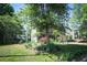 Charming two-story home with a manicured front lawn and mature trees offering shade and curb appeal at 176 Oakland Way, Dallas, GA 30157