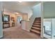Upstairs hallway with neutral walls, carpet, stairs and natural light at 176 Oakland Way, Dallas, GA 30157