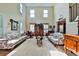 Spacious living room with high ceilings, natural light, and classic furnishings at 176 Oakland Way, Dallas, GA 30157