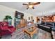 Open-concept living room with hardwood floors, comfortable seating, and natural light offers an inviting atmosphere at 176 Oakland Way, Dallas, GA 30157