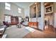 Open living room featuring large windows, high ceilings, and a view of the staircase at 176 Oakland Way, Dallas, GA 30157