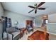 A comfortable living space featuring wicker furniture and a ceiling fan, perfect for relaxation and enjoyment at 176 Oakland Way, Dallas, GA 30157