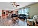 Spacious living room with hardwood floors, plush seating, and fireplace offers an ideal space at 176 Oakland Way, Dallas, GA 30157