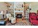 Cozy living room features fireplace with built-ins, and a sitting area to relax and unwind at 176 Oakland Way, Dallas, GA 30157