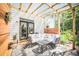 Relaxing outdoor patio with comfortable seating and a stylish rug, perfect for entertaining or relaxing at 176 Oakland Way, Dallas, GA 30157