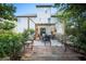 Inviting backyard patio with a dining set, garden, and a serene outdoor retreat at 176 Oakland Way, Dallas, GA 30157