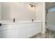 A bathroom featuring double sinks, modern fixtures, and a tile-surround tub/shower at 2200 Upper Burris Rd, Canton, GA 30114