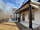 Charming covered porch with timber columns, a stamped concrete patio, and landscaped walkway at 2200 Upper Burris Rd, Canton, GA 30114