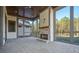 Beautiful screened porch with a stone fireplace and brick flooring at 2200 Upper Burris Rd, Canton, GA 30114