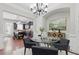 Bright dining area with modern chandelier, hardwood floors, and open layout at 2828 Broughton Se Ln, Atlanta, GA 30339