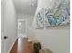 Inviting hallway features hardwood floors and decorative wall art at 2828 Broughton Se Ln, Atlanta, GA 30339