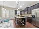Spacious kitchen featuring granite countertops, stainless steel appliances, and island at 2828 Broughton Se Ln, Atlanta, GA 30339