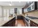 Modern kitchen boasting stainless steel appliances, granite countertops, and hardwood floors at 2828 Broughton Se Ln, Atlanta, GA 30339