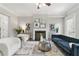 Cozy living room featuring fireplace, hardwood floors, and neutral décor at 2828 Broughton Se Ln, Atlanta, GA 30339