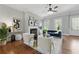 Open-concept living room with fireplace, modern furniture, and natural light at 2828 Broughton Se Ln, Atlanta, GA 30339