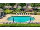Community pool with lounge chairs and umbrellas for relaxation at 2828 Broughton Se Ln, Atlanta, GA 30339