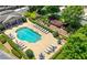Aerial view of a sparkling community pool with lounge chairs and landscaped surroundings at 2828 Broughton Se Ln, Atlanta, GA 30339