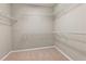 Walk-in closet with carpet and white metal shelving at 2828 Broughton Se Ln, Atlanta, GA 30339