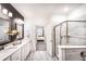 Spacious bathroom with double vanity, marble floors and a glass enclosed shower at 3351 Orwell Way # 2305, Cumming, GA 30041