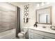 Bright bathroom featuring a shower-tub combination, modern vanity, and stylish decorative accents at 3351 Orwell Way # 2305, Cumming, GA 30041