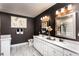 Luxurious bathroom with dual vanities, a modern toilet, and stylish wall decor at 3351 Orwell Way # 2305, Cumming, GA 30041