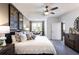 Comfortable bedroom with a ceiling fan, neutral decor, and ample natural light at 3351 Orwell Way # 2305, Cumming, GA 30041