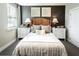 Comfortable bedroom with neutral color palette, decorative pillows, and natural woven headboard at 3351 Orwell Way # 2305, Cumming, GA 30041