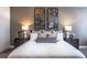 Serene bedroom featuring a neatly made bed, and stylish lamps on matching nightstands at 3351 Orwell Way # 2305, Cumming, GA 30041