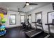 Brightly lit gym featuring treadmills, elliptical machine, ceiling fans, and fitness equipment at 3351 Orwell Way # 2305, Cumming, GA 30041