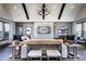 Open-concept living room with high ceilings, a stone fireplace, and modern decor at 3351 Orwell Way # 2305, Cumming, GA 30041