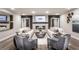 Spacious living room featuring a stone fireplace, stylish decor, and comfortable seating arrangement at 3351 Orwell Way # 2305, Cumming, GA 30041