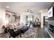 A spacious living room featuring an open layout, with a dining area and balcony access at 3351 Orwell Way # 2305, Cumming, GA 30041
