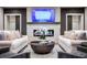 A beautifully designed living room featuring a modern fireplace and comfortable seating at 3351 Orwell Way # 2305, Cumming, GA 30041