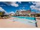 Stunning pool and clubhouse area with ample seating, umbrellas, and comfortable lounge chairs at 3351 Orwell Way # 2305, Cumming, GA 30041
