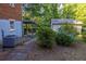 Spacious backyard featuring a detached garage, a covered patio, and lush landscaping at 4370 Tradition Ter, Austell, GA 30106