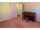 Bedroom with piano; potential for use as a music room or flexible living space at 4370 Tradition Ter, Austell, GA 30106