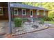 Well-maintained front yard featuring a brick home with shutters, mature landscaping, and a stone walkway at 4370 Tradition Ter, Austell, GA 30106