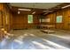 Detached garage interior featuring concrete floor, exposed framing, shelving, and a table, with windows for natural light at 4370 Tradition Ter, Austell, GA 30106