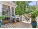 Outdoor deck with a stainless steel grill and stairs to the in-ground pool at 5178 Stefan Ridge Way, Buford, GA 30519
