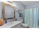 Charming bathroom with sea-themed decor and shower curtain at 5178 Stefan Ridge Way, Buford, GA 30519