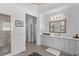 Primary bathroom with walk-in shower and double vanity with white countertops at 5178 Stefan Ridge Way, Buford, GA 30519