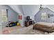 Cozy bedroom with sloped ceilings, carpeted floor, and large windows at 5178 Stefan Ridge Way, Buford, GA 30519