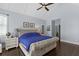 Primary bedroom with vaulted ceiling and large window with view of the backyard at 5178 Stefan Ridge Way, Buford, GA 30519