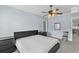 Bedroom with calm colors, a ceiling fan, and a view into the kitchen at 5178 Stefan Ridge Way, Buford, GA 30519