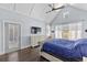 Bedroom with vaulted ceilings, ceiling fan, large windows, and door to a private deck at 5178 Stefan Ridge Way, Buford, GA 30519