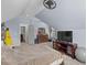 Bedroom with sloped ceilings and a plush carpeted floor at 5178 Stefan Ridge Way, Buford, GA 30519