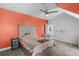 Well-lit bedroom featuring carpeted floors and a gray accent wall at 5178 Stefan Ridge Way, Buford, GA 30519