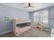 Light blue bedroom with a bunkbed and window at 5178 Stefan Ridge Way, Buford, GA 30519