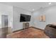 Bonus room with television, orange and blue accent rug, and a comfortable beanbag at 5178 Stefan Ridge Way, Buford, GA 30519