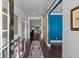Welcoming entryway with hardwood floors, stylish decor, and a view into the living spaces at 5178 Stefan Ridge Way, Buford, GA 30519